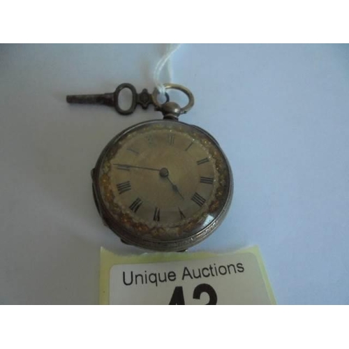 43 - A Victorian silver cased fob watch with key.