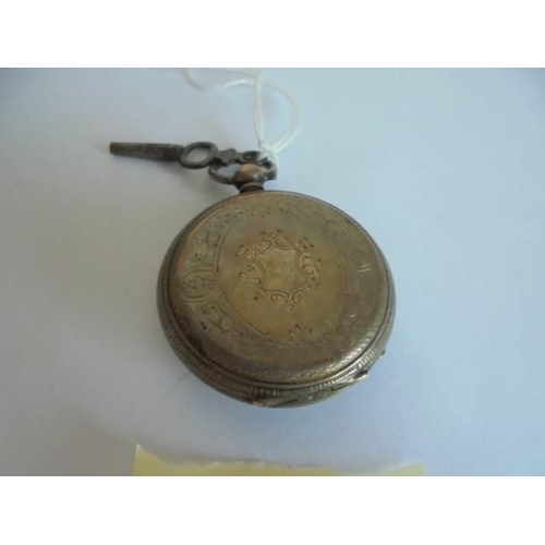 43 - A Victorian silver cased fob watch with key.