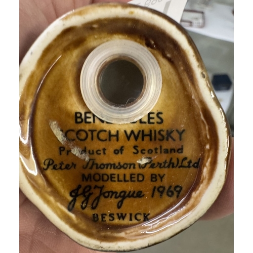 1711 - 2 Beswick Ben Eagles whiskey miniatures & contents of a bear & an eagle