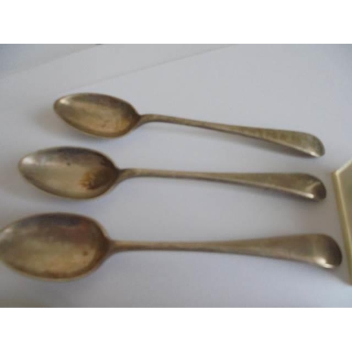 104 - Six silver teaspoons, a silver thimble, silver coins, chains etc.,