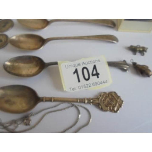 104 - Six silver teaspoons, a silver thimble, silver coins, chains etc.,