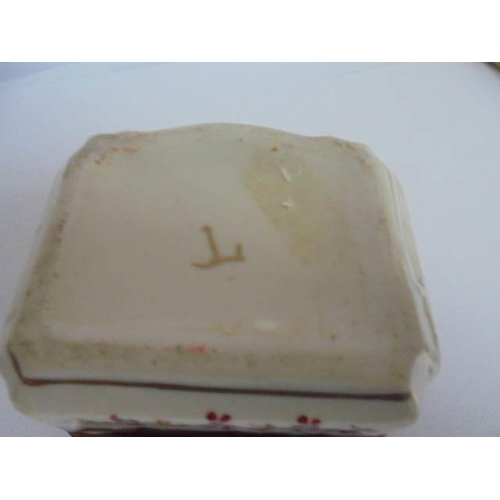 111 - A 19th century porcelain trinket box.