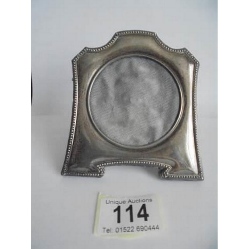 114 - An early 20th century silver photo frame.