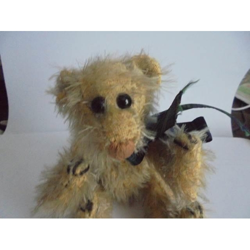 116 - A miniature jointed Teddy bear.