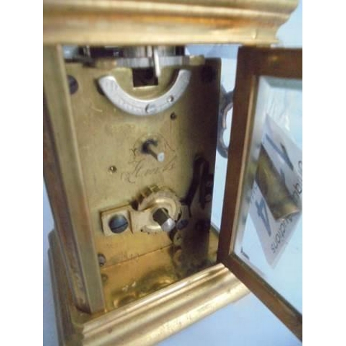 120 - A miniature brass carriage clock,   in working order.