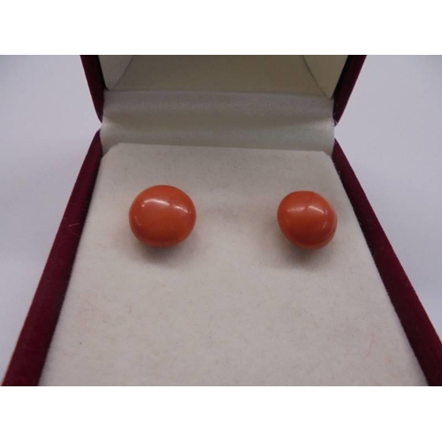 17 - A pair of vintage natural coral stud earrings with gold posts (no backs).