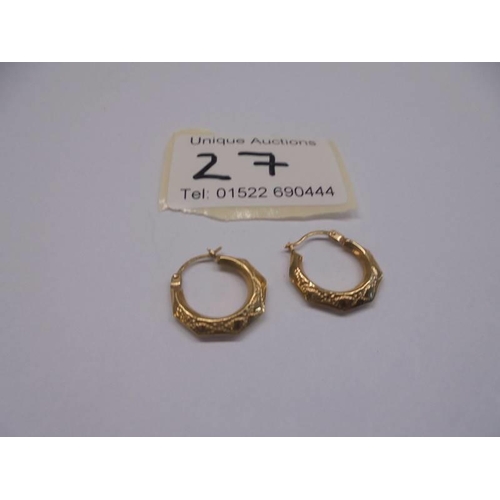 27 - A pair of 9ct gold textured hoop earrings.