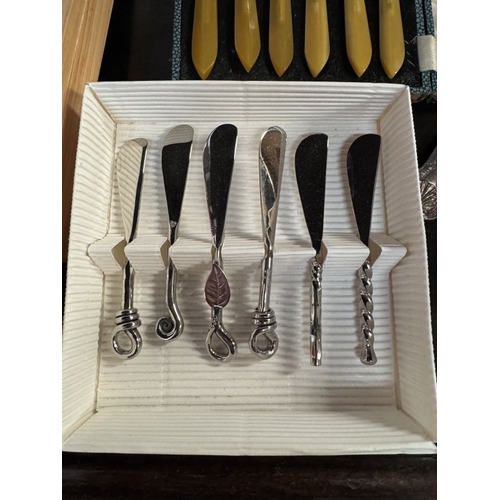 1855 - A chopping board with integral drawers with knives & other cutlery etc.