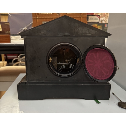 1856 - A 19th century black slate Palladian mantle clock