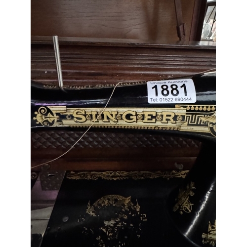 1881 - A vintage Singer sewing machine, serial number S826962