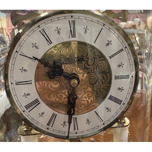 1888 - An anniversary clock under plastic dome