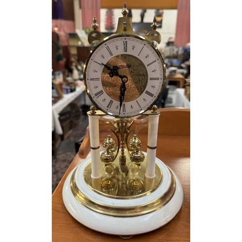 1888 - An anniversary clock under plastic dome