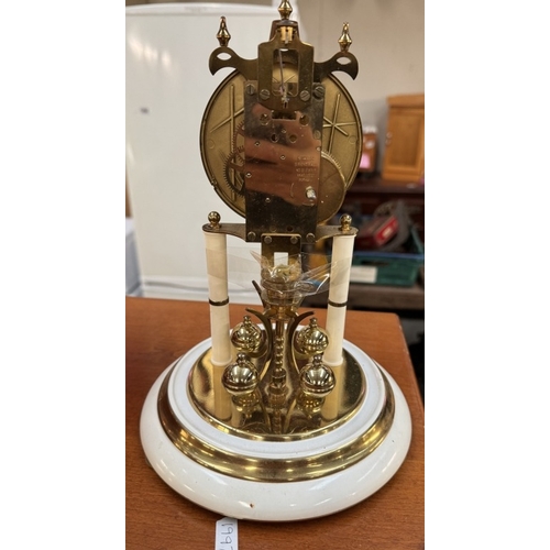 1888 - An anniversary clock under plastic dome