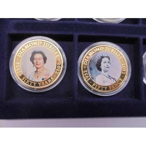 33 - 22 cased 1952-2012 Diamond Jubilee gold plate coins, A Royal Engagement coin and Roman Army coin.