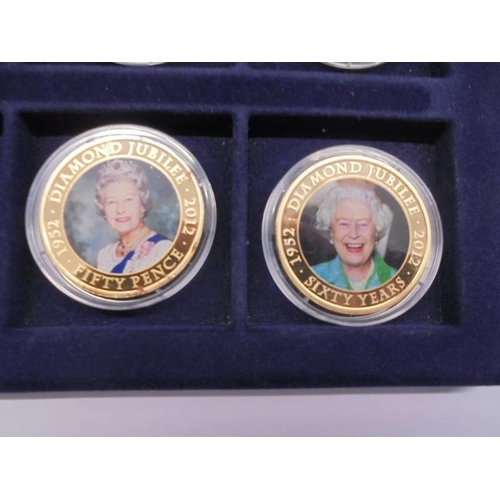 33 - 22 cased 1952-2012 Diamond Jubilee gold plate coins, A Royal Engagement coin and Roman Army coin.