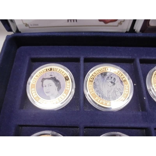 33 - 22 cased 1952-2012 Diamond Jubilee gold plate coins, A Royal Engagement coin and Roman Army coin.