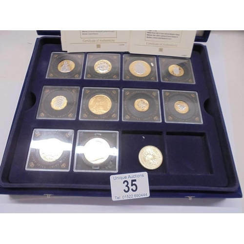 35 - Eight cased Queen Elizabeth II coins and a Victoria coin.