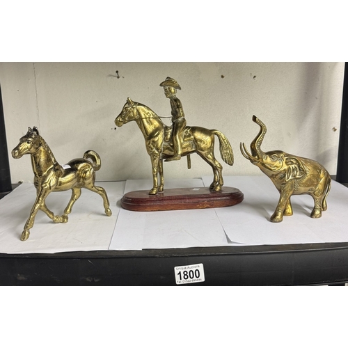 1800 - A brass horse mounted with cowboy, Another brass horse & an elephant