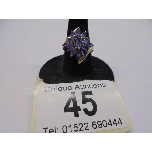 45 - A 9ct gold tanzanite large cluster ring, size L half, 2.99 grams.