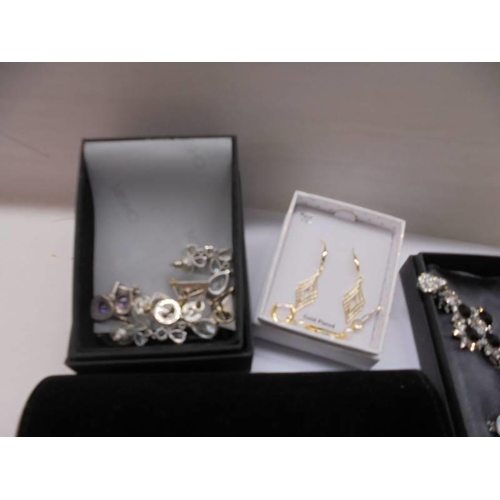 53 - A mixed lot of necklaces, earings, watches etc.,