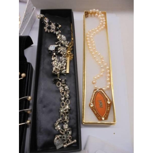 53 - A mixed lot of necklaces, earings, watches etc.,