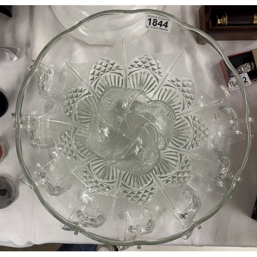 1844 - A glass punch bowl with cups.