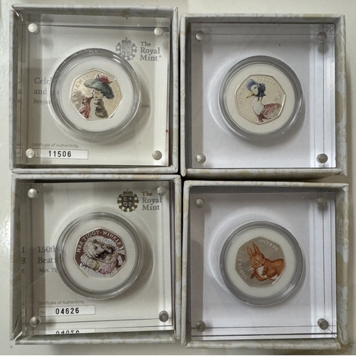 71 - A collection of 12 boxed & slabbed Beatrix Potter silver proof 50p coins including 150 years