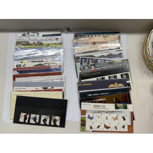 59 - A collection of Royal Mail presentation packs, Many 1st class. Well over £200 in face value