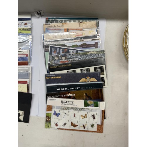 59 - A collection of Royal Mail presentation packs, Many 1st class. Well over £200 in face value