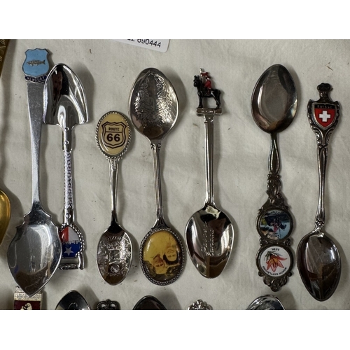 1909 - A collection of tourist collectors spoons & a quantity of thimbles