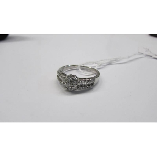 48 - A white gold and diamond ring, size N half, 3.62 grams.