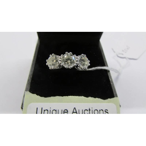 50 - An 18ct three stone diamond ring, size Q. 5.41 grams.