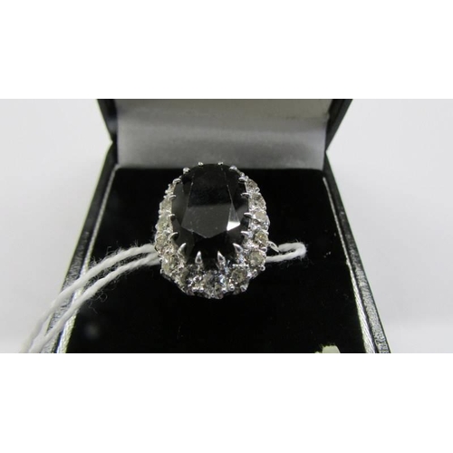 51 - A white gold sapphire and diamond ring, size P half, 6.26 grams.