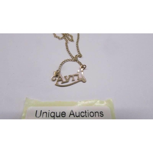 62 - A 9ct gold necklace with Avril name tag, 1.5 grams.