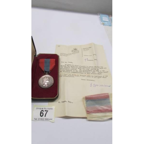 67 - An imperial service medal in presentation case with paperwork, presented to W drake, 1967.