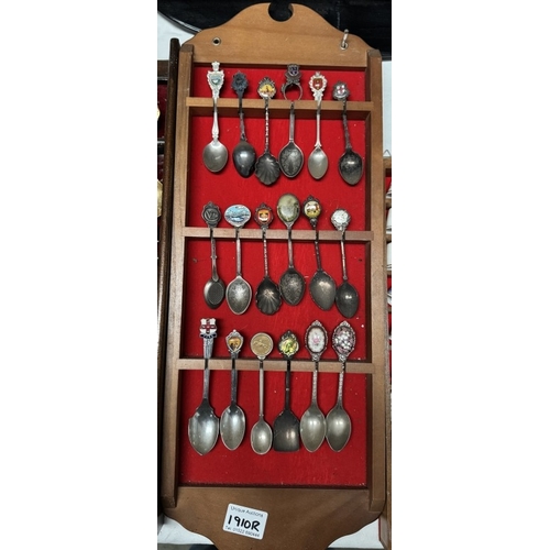 1910R - A large collection of ceramic thimbles & tourist spoons on display racks