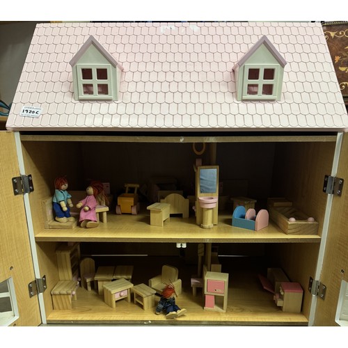 1920C - A wooden dolls house with wooden accessories