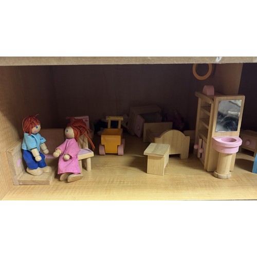 1920C - A wooden dolls house with wooden accessories