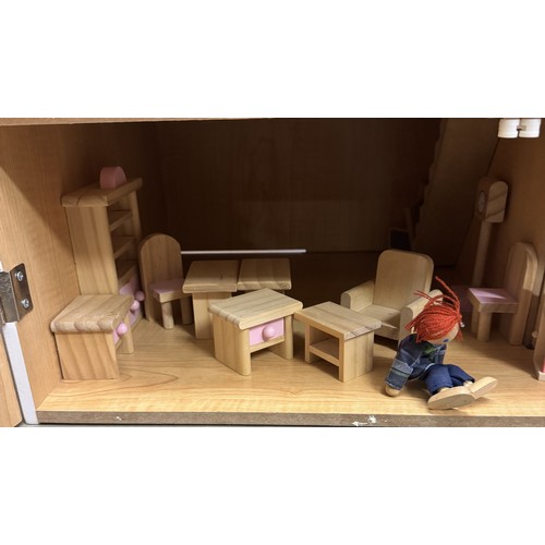 1920C - A wooden dolls house with wooden accessories