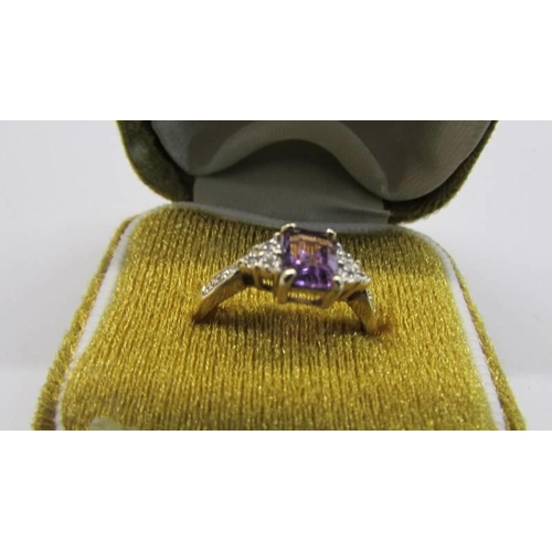 76 - A 9ct gold amethyst ring with diamond shoulders, size O, 2.12 grams.