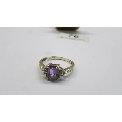 76 - A 9ct gold amethyst ring with diamond shoulders, size O, 2.12 grams.