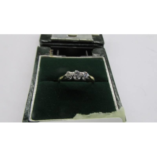 79 - A circa 1930/40's three stone diamond ring stamped 18ct/platinum, size L, 2.73 grams.