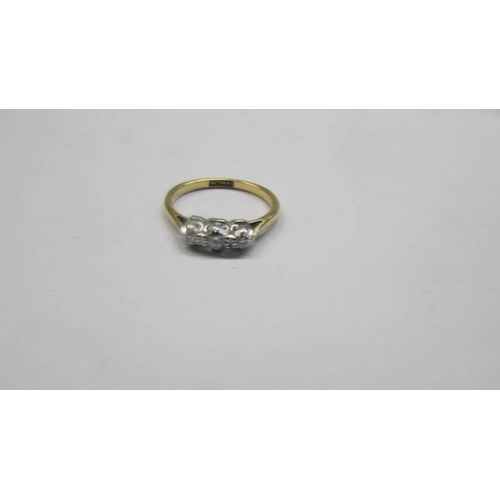 79 - A circa 1930/40's three stone diamond ring stamped 18ct/platinum, size L, 2.73 grams.