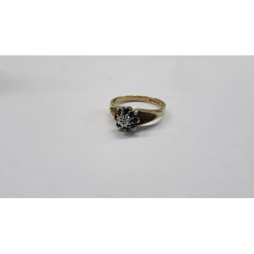 83 - A diamond and sapphire cluster ring, dated Sheffield 1979, 9ct gold, size L, 2.15 grams.