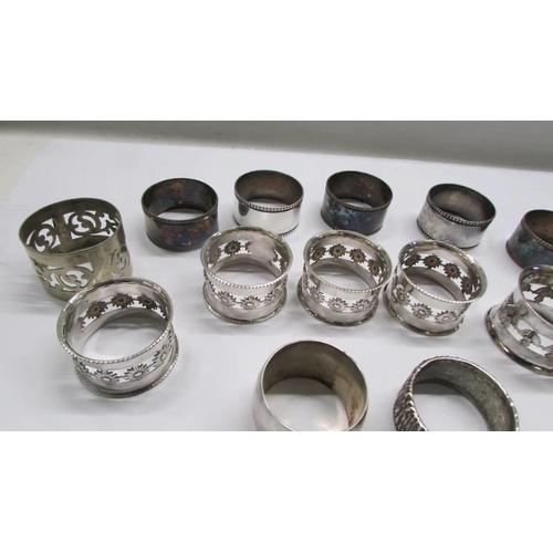 98 - Fifteen assorted silver plate napkin rings including a set of six.