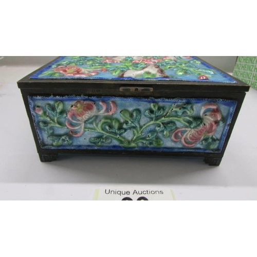 99 - An old Chinese repousse' cloissonne' enamel box, 11.5 x 8.5 x 5.25 cm.