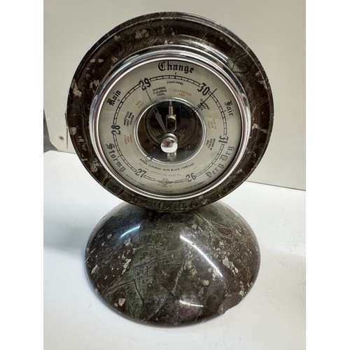 302 - A Cornish serpentine clock by Stevens & Sons Penzance & A Cornish serpentine barometer