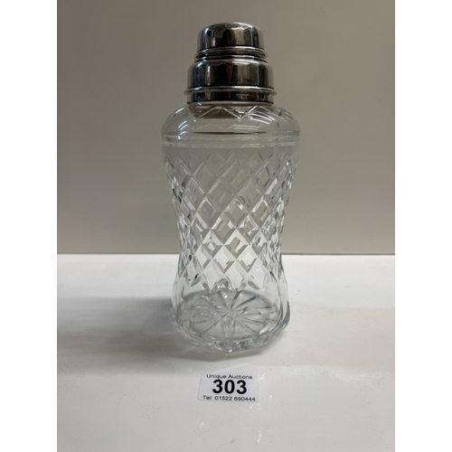 303 - A cut glass cocktail shaker with sterling silver fittings. Height 22.5cm