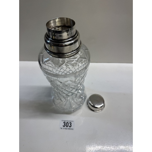 303 - A cut glass cocktail shaker with sterling silver fittings. Height 22.5cm