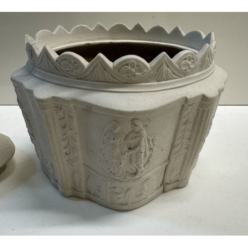 305 - An early 19th century salt glaze sugar caddy with lid. Relief decorated with mourning figures. A/F